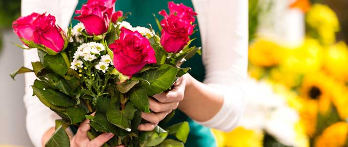 person holding bouquet of flowers