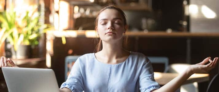 calm woman at a desk