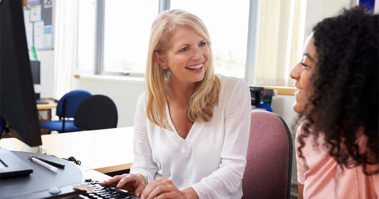 smiling woman using a computer