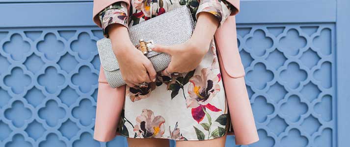 woman holding a clutch