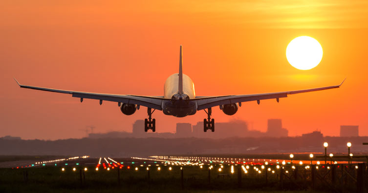 plane landing at sunset