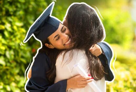 Graduate hugging mother