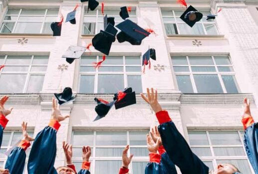 graduates throwing hats in the air