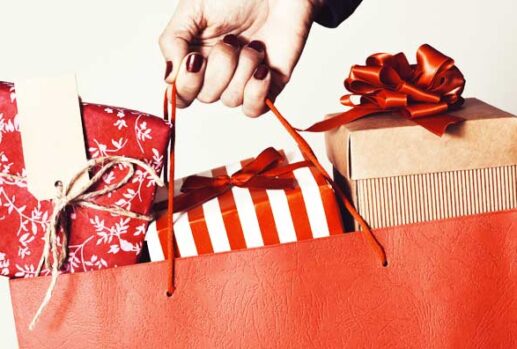 hand holding bag of presents