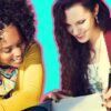 Two women looking at notes