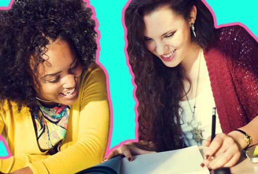 Two women looking at notes