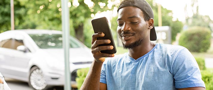 man looking at phone