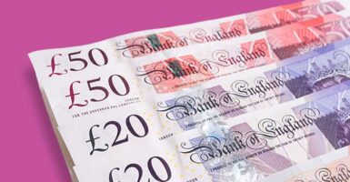 uk money notes against pink background