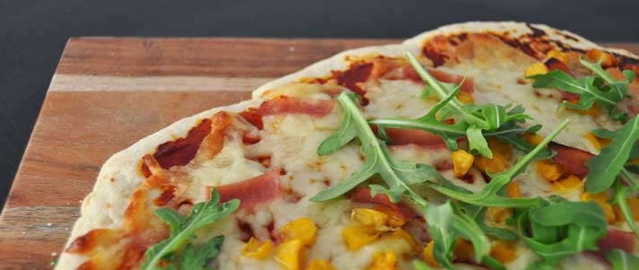 homemade ham sweetcorn and rocket pizza