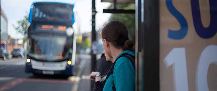 Student waiting for a Stagecoach bus