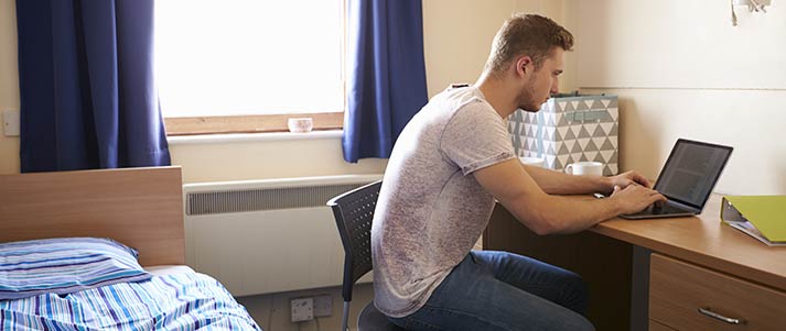 Student in university halls room