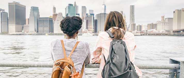 Two friends in front of new york skyline