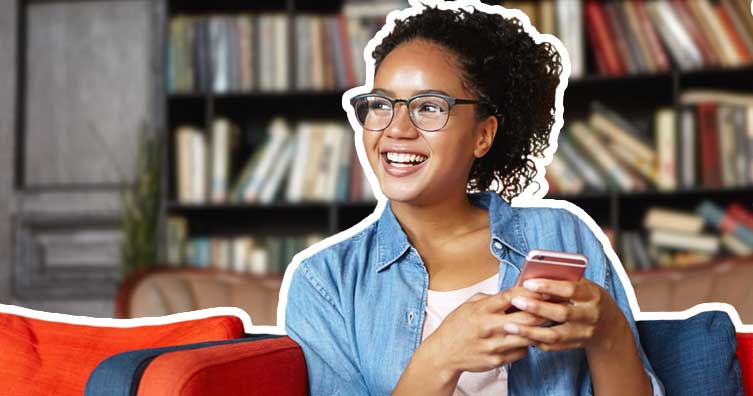 woman smiling using phone