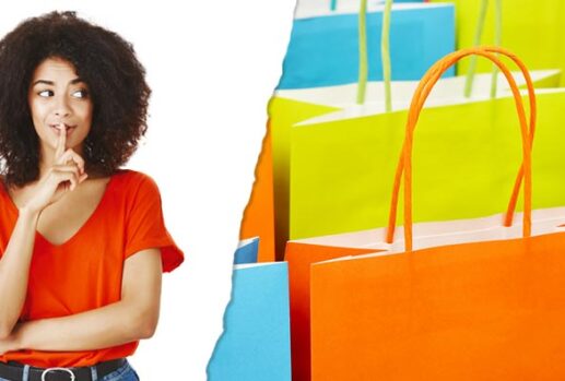 Woman shushing and colourful shopping bags