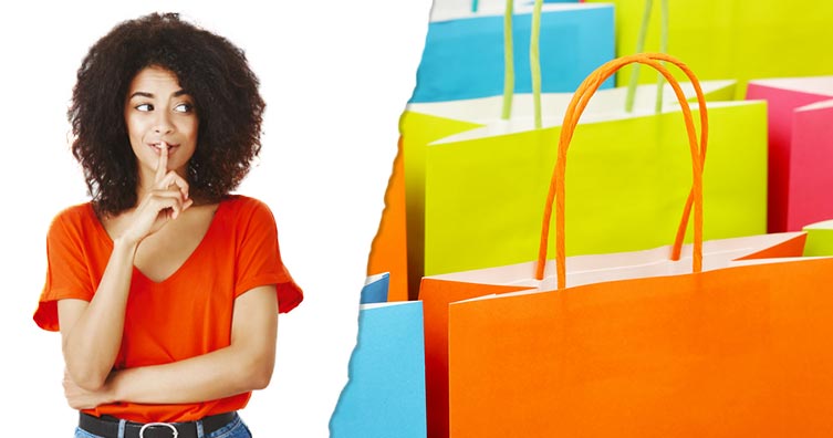 Woman shushing and colourful shopping bags