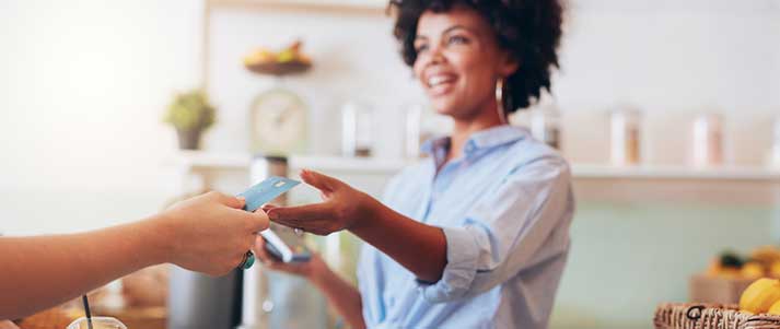 Handing over card to barista