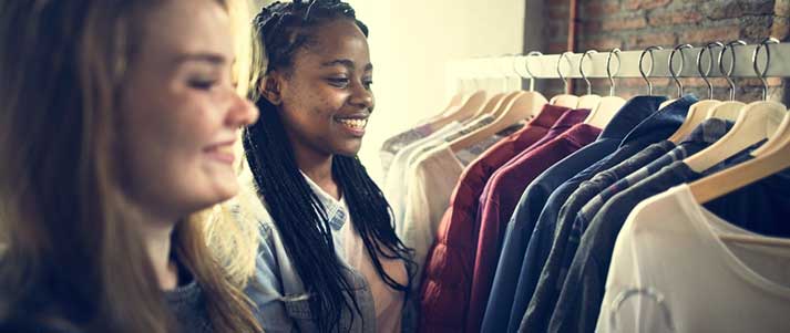 two friends shopping for clothes